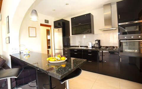 Lolita: Countertop, Room, Property, Interior Design, Furniture, Kitchen, Building, Yellow, Floor, Ceiling