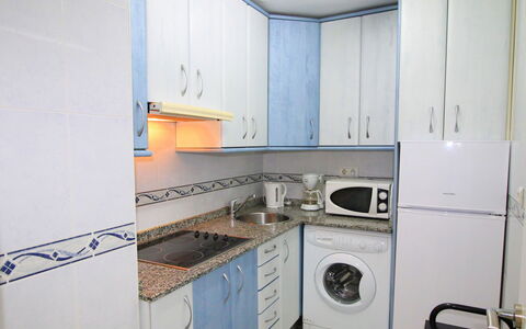 Las Palmeras: Property, Room, Major Appliance, Kitchen, Cabinetry, Laundry Room, Countertop, Furniture, Building, Kitchen Stove