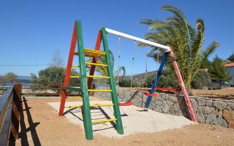 Novigrad (Zadar) 136: Playground, Public Space, Outdoor Play Equipment, Human Settlement, Beach, Sky, Sand, Playground Slide, City, Recreation