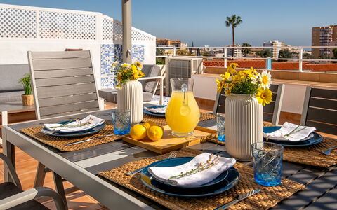 Lola Playa: Flower, Sky, Table, Tableware, Plant, Furniture, Property, Azure, Flowerpot, Dishware