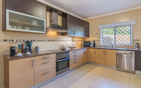 Vila Caravela: Property, Room, Kitchen, Cabinetry, Furniture, Real Estate, Building, House, Yellow, Countertop