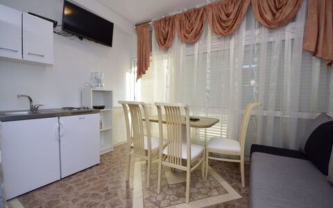Ojdana: Property, Cabinetry, Countertop, Sink, Wood, Curtain, Kitchen Appliance, Kitchen Stove, Interior Design, Table