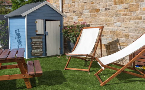 Les Terrasses de la Plage: Yard, Grass, Backyard, Furniture, Property, Chair, Outdoor Furniture, Cottage, Folding Chair, House