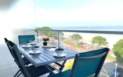 Arcachon 241: Sky, Table, Furniture, Property, Water, Building, Cloud, Chair, Azure, Tableware