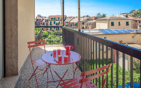 Giulia Apartment 2 - Levanto: Sky, Table, Furniture, Property, Building, Plant, Chair, Window, Azure, Wood