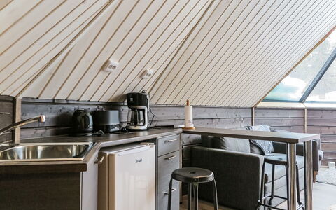 Arctic Light Hut: Furniture, Wood, Interior Design, Ceiling, Kitchen, Flooring, Countertop, Floor, Attic, Kitchen Appliance