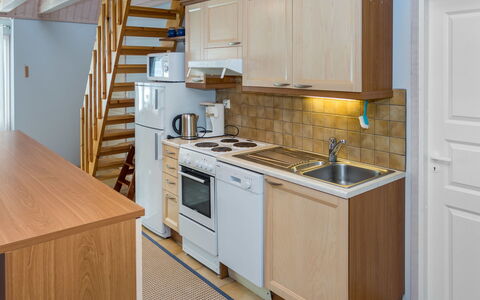 Nelikko a: Kitchen, Furniture, Flooring, Major Appliance, Kitchen Appliance, Countertop, Interior Design, Cabinetry, Wood, Floor