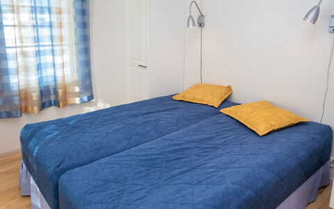 Nelikko a: Furniture, Interior Design, Floor, Flooring, Wood, Bedroom, Linens, Textile, Bed, Room