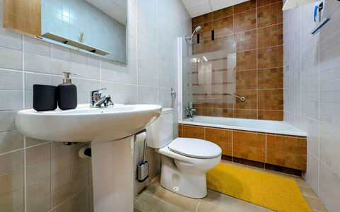 Style: Toilet Seat, Bathroom, Plumbing Fixture, Toilet, Flooring, Floor, Interior Design, Sink, Plumbing, Tile