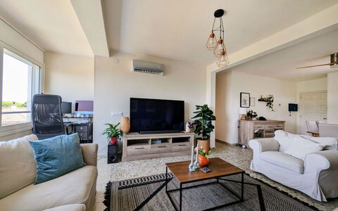 Style: Furniture, Couch, Interior Design, Flooring, Living Room, Ceiling, Floor, Room, Table, Television