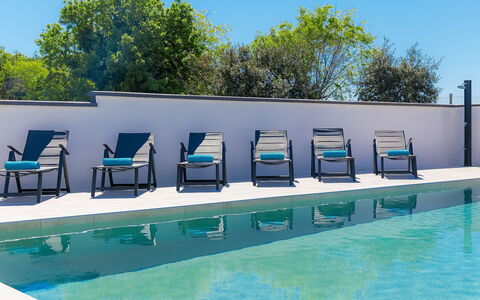 Ella Premantura: Water, Sky, Building, Green, Blue, Shade, Swimming Pool, Outdoor Furniture, Urban Design, House