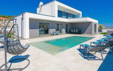 Ella Premantura: Sky, Property, Furniture, Building, Window, Swimming Pool, Blue, Azure, Shade, Outdoor Furniture