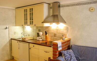 Mar 100.2: Room, Property, Furniture, Kitchen, Cabinetry, Interior Design, Countertop, Yellow, Building, House