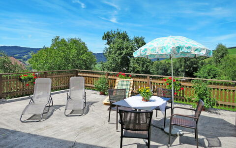 Mayrhofer: Sky, Furniture, Cloud, Plant, Table, Property, Chair, Shade, Outdoor Table, Umbrella