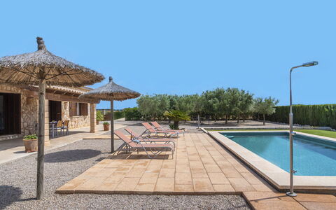Marinassa: Sky, Water, Shade, Tree, Swimming Pool, Outdoor Furniture, Plant, Street Light, Building, Real Estate