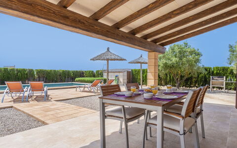 Marinassa: Property, Table, Shade, Sky, Plant, Wood, Flowerpot, Interior Design, Architecture, Outdoor Furniture