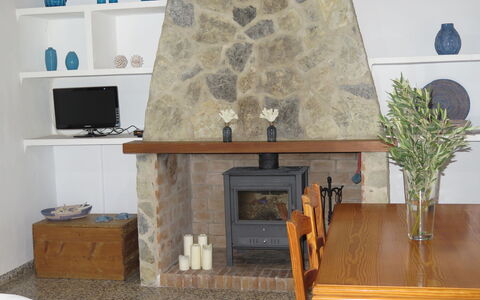 S'Almunia: Hearth, Fireplace, Room, Property, Furniture, Living Room, Interior Design, Table, Wall, House