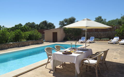 S'Almunia: Property, Swimming Pool, Real Estate, Building, House, Vacation, Furniture, Patio, Home, Shade