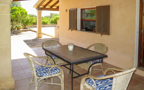 S'Almunia: Table, Furniture, Property, Plant, Chair, Building, Wood, Interior Design, Shade, Outdoor Furniture