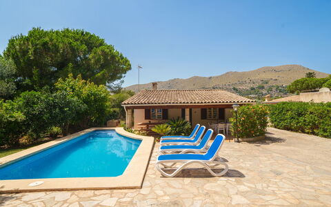 Ullastro Pollença: Plant, Water, Property, Sky, Building, Azure, Tree, Swimming Pool, Outdoor Furniture, Land Lot