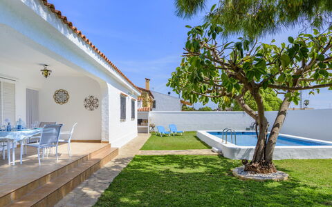 Villa Lolin: Plant, Sky, Building, Shade, Land Lot, Outdoor Furniture, Grass, Leisure, Chair, Tree
