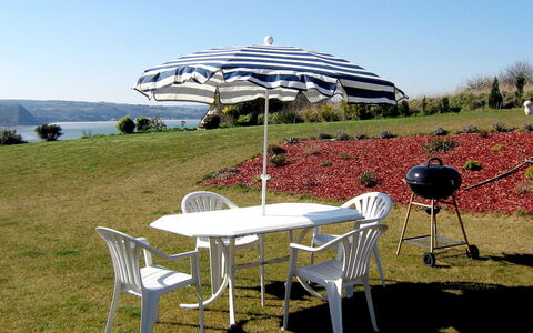 Belle Vue sur Mer: Umbrella, Furniture, Table, Chair, Grass, Leisure, Architecture, Shade, Plant Community, Tree