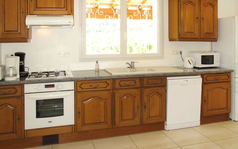 Les Lilas Blancs: Cabinetry, Furniture, Countertop, Kitchen, Room, Property, Major Appliance, Floor, Interior Design, Building