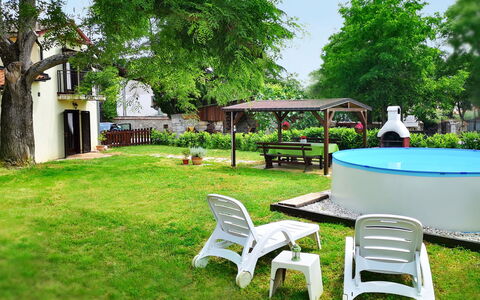 Sara: Property, Grass, Backyard, Yard, Lawn, Tree, Garden, Building, Real Estate, House
