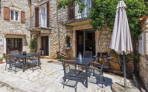 Erika: Table, Furniture, Plant, Window, Building, Chair, Outdoor Table, Flowerpot, Road Surface, Outdoor Furniture