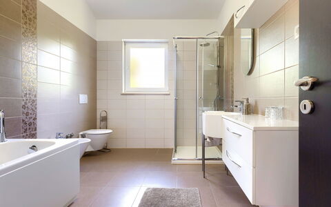 Villa Vela: Bathtub, Building, Plumbing Fixture, Mirror, Sink, Bathroom, Tap, House, Door