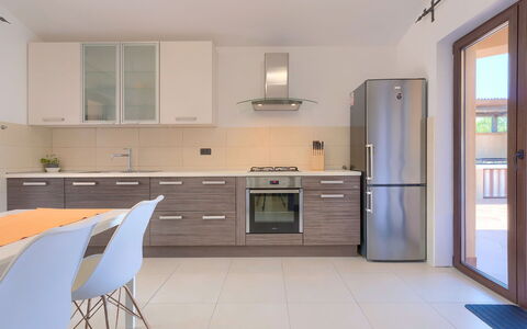 Andrea: Cabinetry, Countertop, Building, Furniture, Kitchen Stove, Kitchen, Tap, Drawer, Kitchen Appliance, Wood