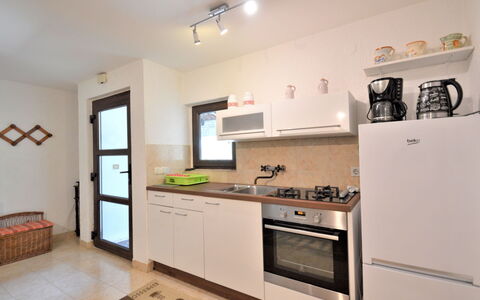 Latin: Cabinetry, Countertop, Kitchen Stove, Kitchen Appliance, Tap, Kitchen, Home Appliance, Sink, Interior Design, Wood