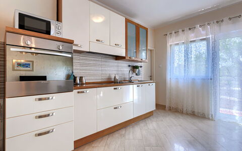 Gea: Cabinetry, Countertop, Property, Furniture, Window, Drawer, Building, Wood, Interior Design, Kitchen