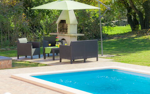 Vita: Swimming Pool, Property, Backyard, Shade, Leisure, Umbrella, House, Grass, Home, Patio