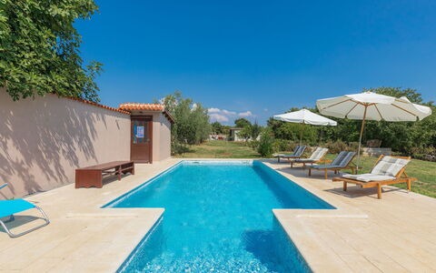 Lancin: Water, Sky, Plant, Swimming Pool, Blue, Azure, Building, Outdoor Furniture, Shade, Sunlounger