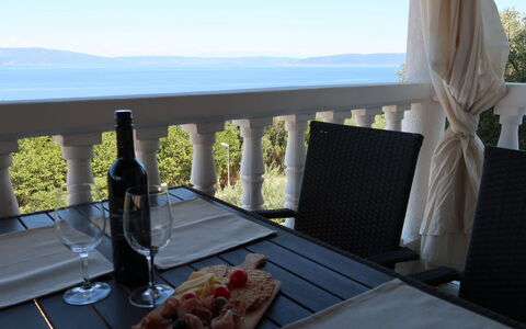 Ulika: Table, Sky, Furniture, Tableware, Food, Property, Chair, Building, Azure, Bottle