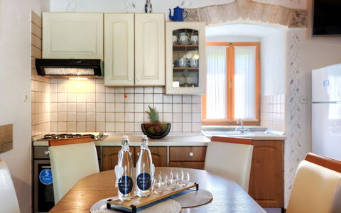 Donada: Table, Cabinetry, Property, Countertop, Furniture, Kitchen Appliance, Kitchen, Wood, Kitchen Stove, Home Appliance