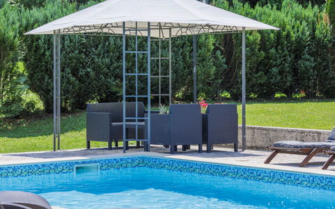 Donada: Water, Plant, Furniture, Property, Swimming Pool, Shade, Outdoor Furniture, Chair, Tree, Umbrella