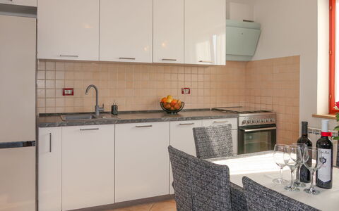 Andrea: Kitchen, Furniture, Countertop, Kitchen Appliance, Interior Design, Flooring, Cabinetry, Major Appliance, Wood, Floor