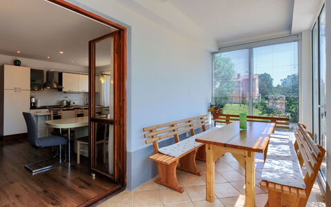 Laura: Furniture, Table, Window, Building, Wood, Houseplant, Living Room, Plant, Interior Design, Flooring