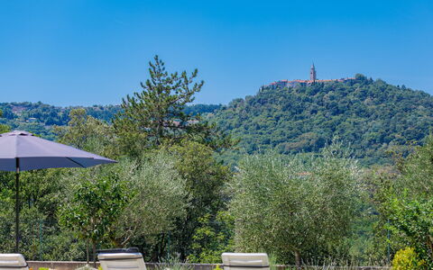 Carla: Sky, Plant, Daytime, Furniture, Ecoregion, Blue, Azure, Mountain, Umbrella, Outdoor Furniture