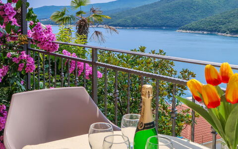 Klaudija: Flower, Water, Sky, Plant, Property, Furniture, Table, Green, Tableware, Mountain