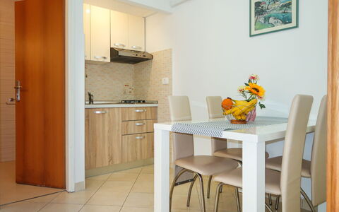 Klaudija: Furniture, Table, Property, Cabinetry, Building, Countertop, Chair, Wood, Picture Frame, Sink