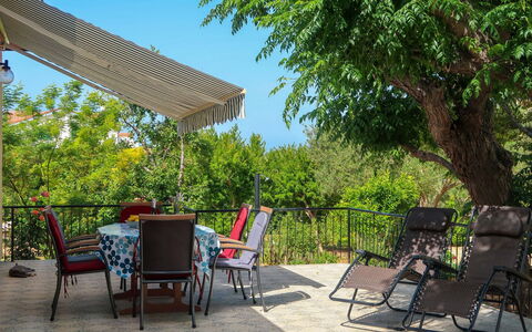 Andela: Furniture, Sky, Property, Plant, Chair, Building, Nature, Shade, Table, Outdoor Table