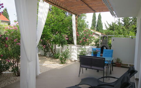 Katarina: Plant, Property, Furniture, Table, Flower, Chair, Shade, Outdoor Furniture, Interior Design, Sky