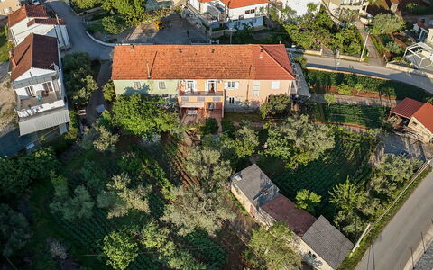 Marijana: Building, Residential Area, House, Roof, Neighbourhood, Home, Town, Suburb, Land Lot, Human Settlement