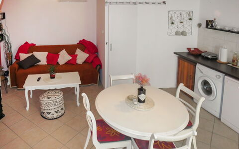 Gojko: Table, Furniture, Property, Couch, Picture Frame, Building, Decoration, Chair, Flower, Flooring