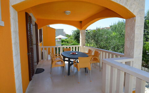 Gorana: Property, Table, Furniture, Plant, Building, Shade, Sky, Chair, Interior Design, Outdoor Furniture