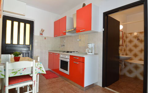 Lila: Cabinetry, Countertop, Furniture, Kitchen, Building, Window, Sink, Kitchen Stove, Orange, Wood