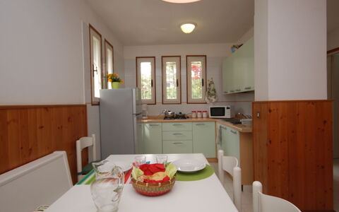 Villa Isolina: Table, Furniture, Property, Cabinetry, Tableware, Lighting, Interior Design, Wood, Chair, Floor